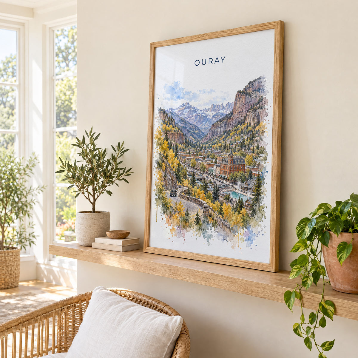 Ouray watercolor print in an oak frame on a picture ledge in a sunlit sunroom