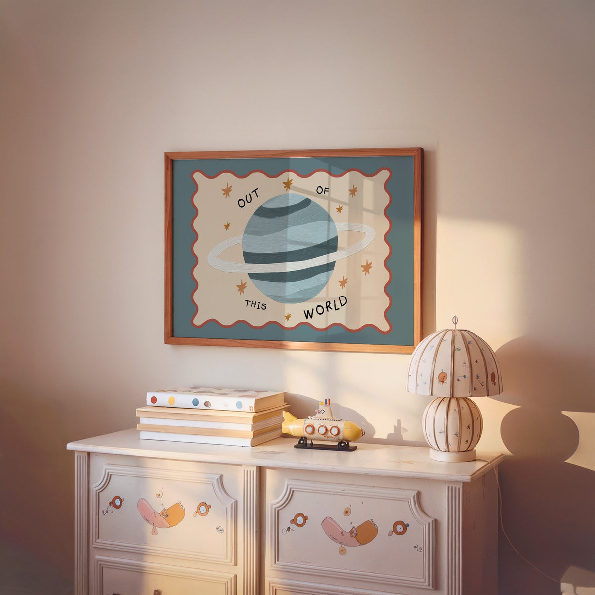 Landscape out of this world planet nursery print in a cherry wood frame above a painted dresser and lamp