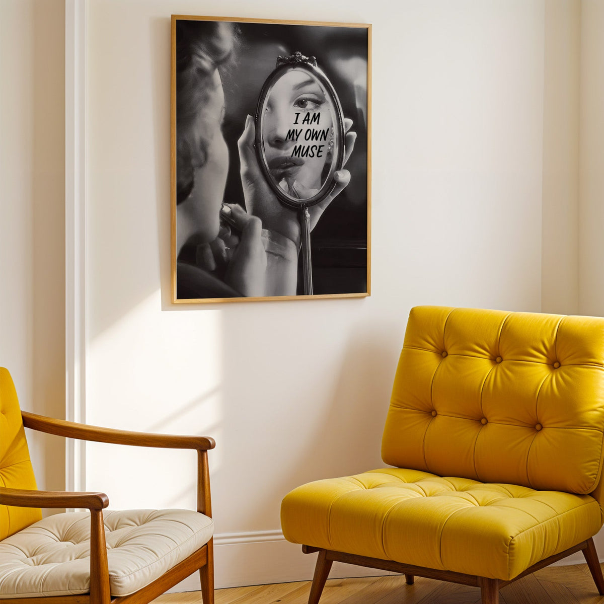 I am my own muse hand mirror portrait print shown in a gold frame above a mustard yellow tufted armchair
