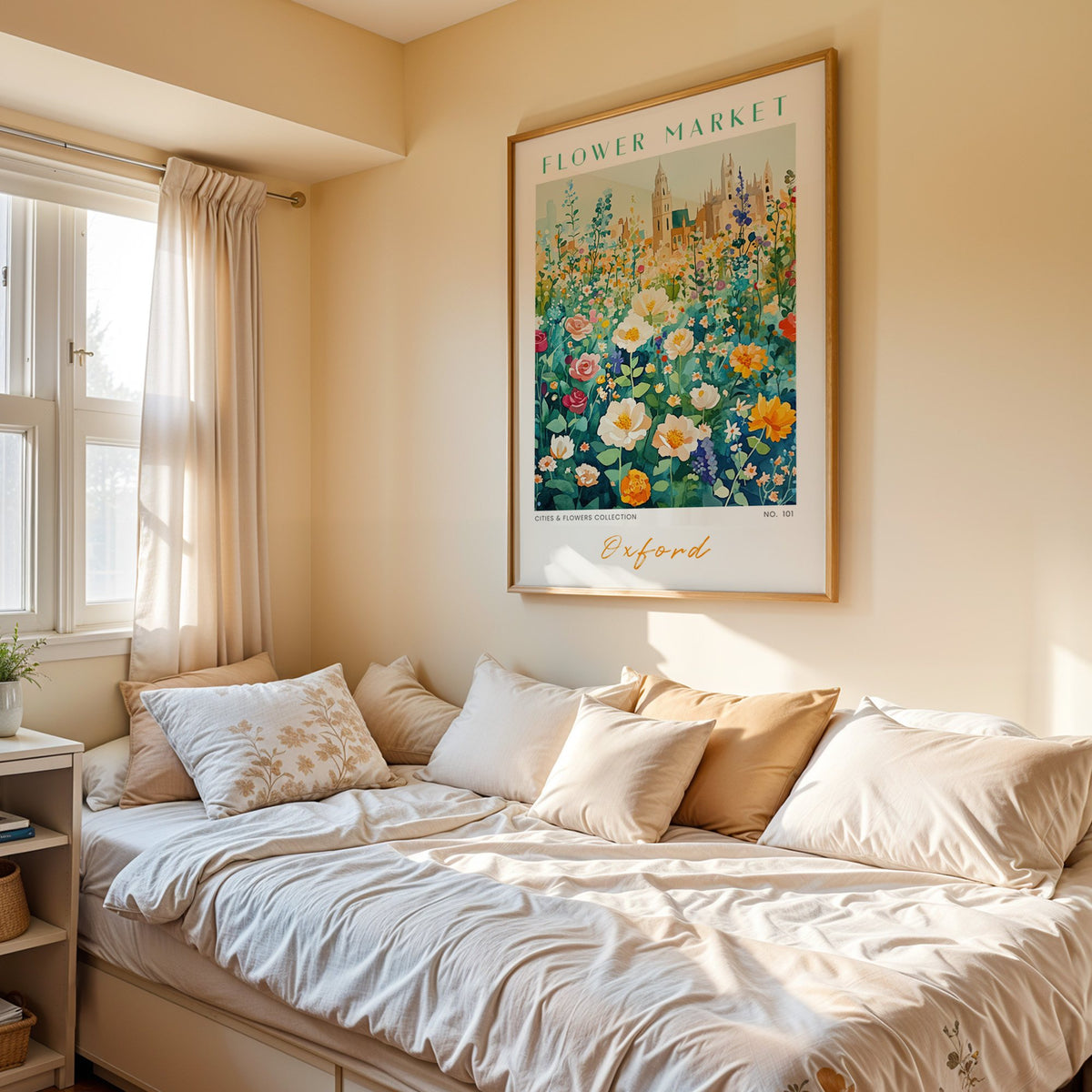 Oxford flower market print in an oak frame above a cream daybed in a sunny bedroom