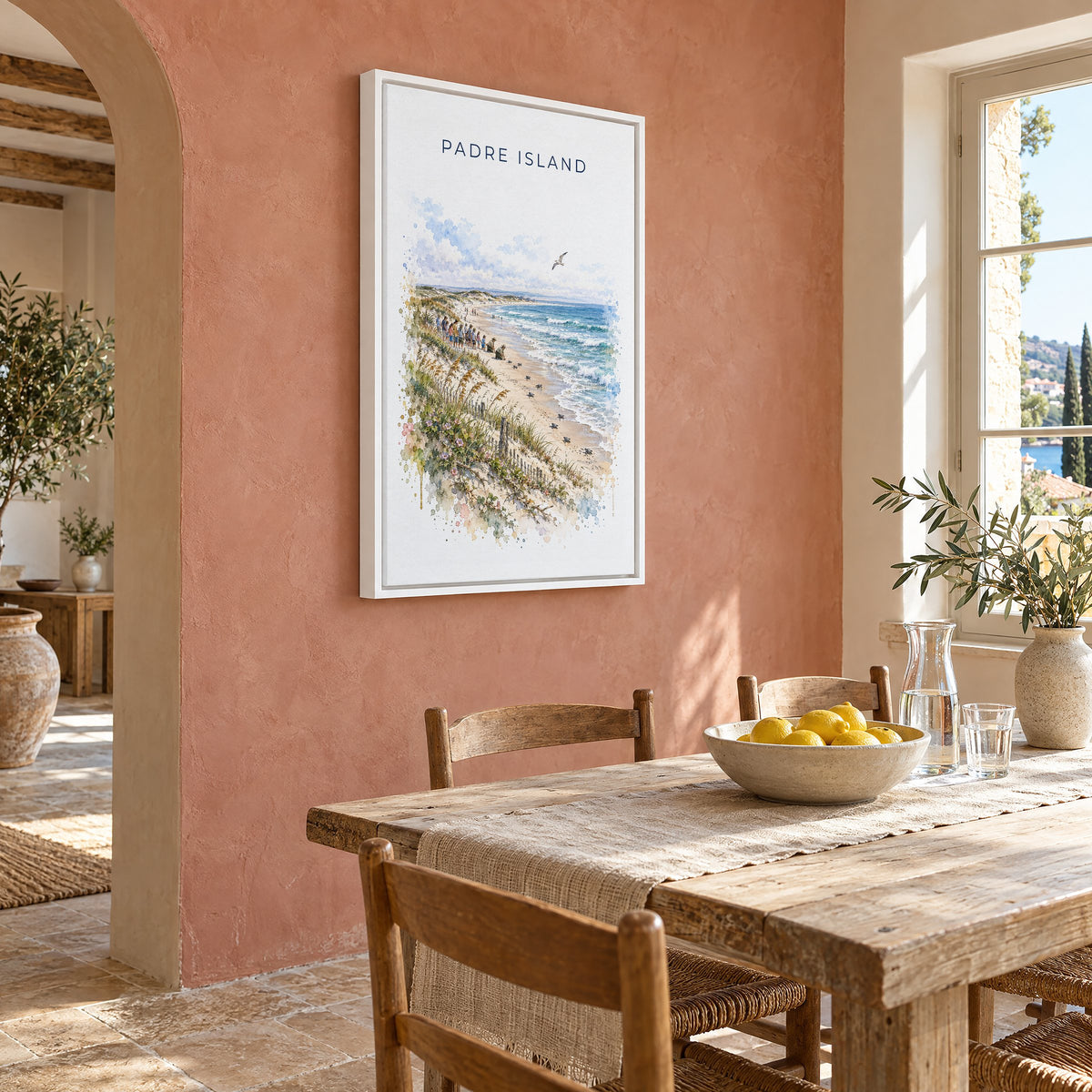 Padre Island National Seashore watercolor print as a white floater canvas on a terracotta wall above a rustic dining table