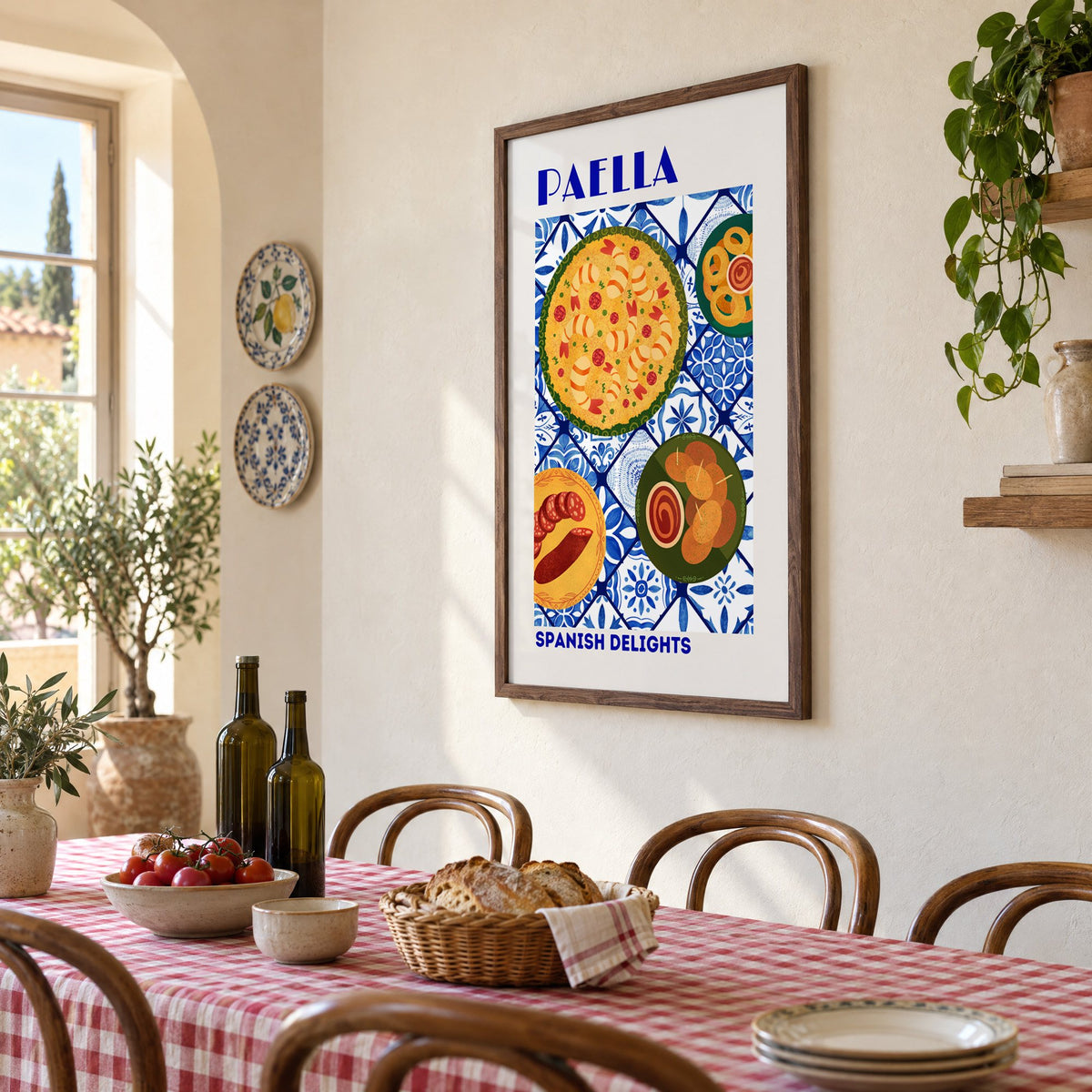 PAELLA Spanish Delights blue tile print in a walnut frame above a gingham-covered trattoria table, seen at an angle