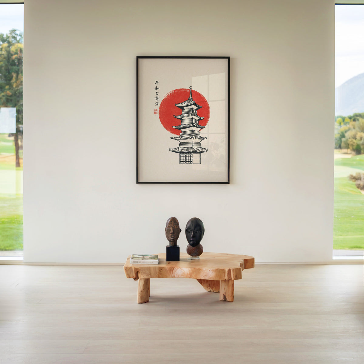 pagoda line art with red sun print in a black frame above a live-edge wood coffee table between garden windows