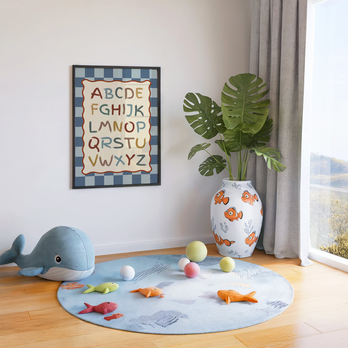 Painted alphabet wavy frame nursery print in a black frame in a playroom with an ocean rug and whale plush