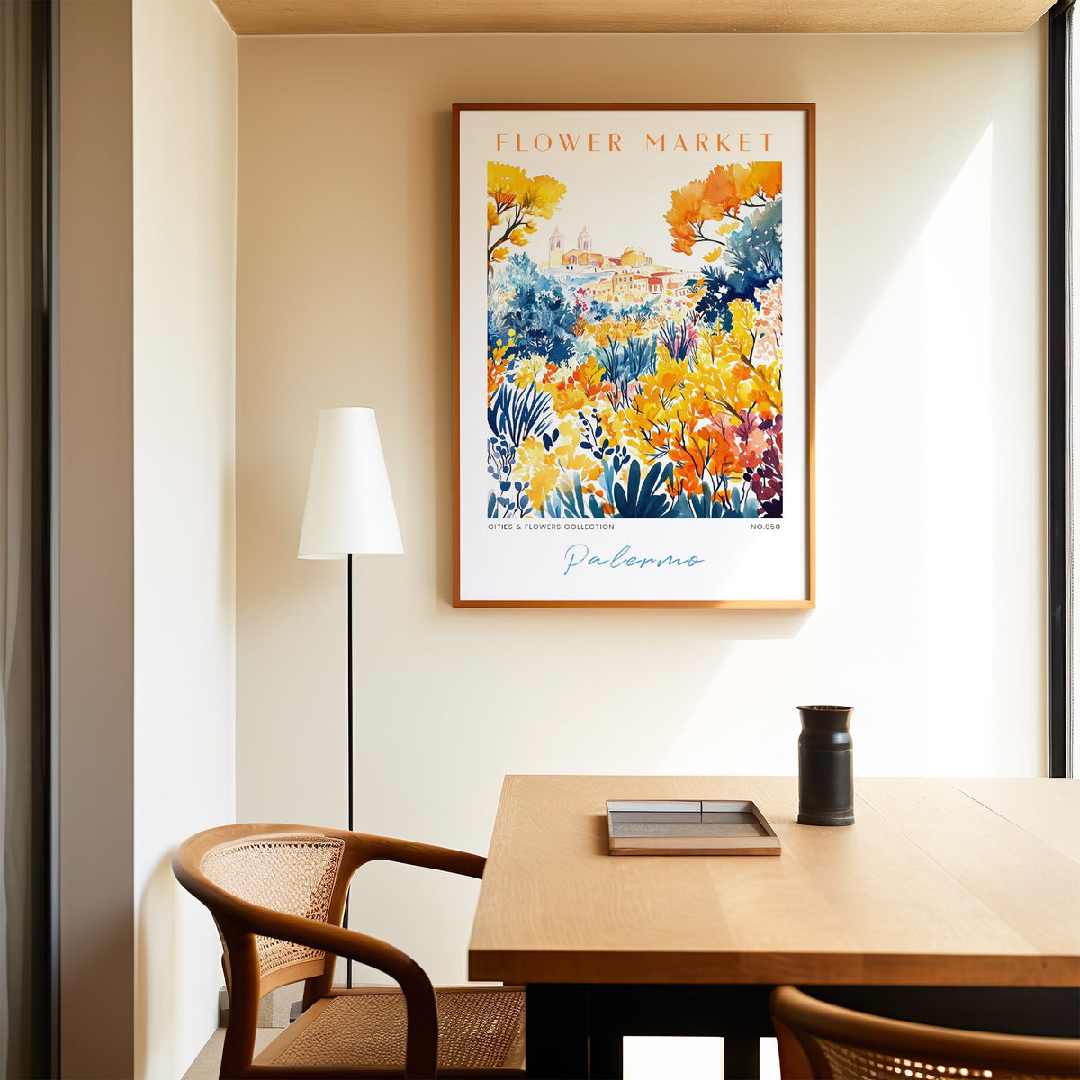 Palermo flower market print in an oak frame above a dining table and cane chair