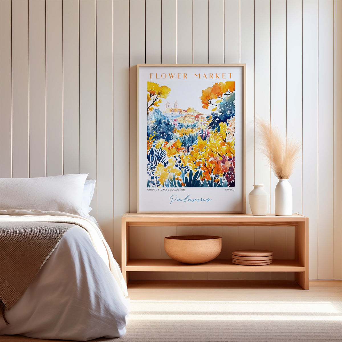 Palermo flower market print in an oak frame on a wood bench against a white shiplap bedroom wall with pampas grass