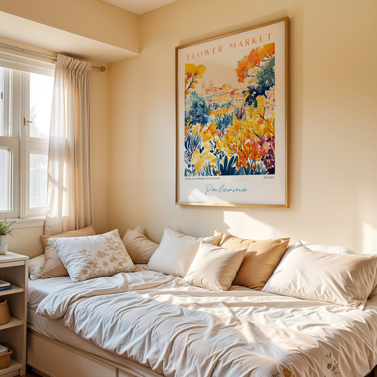Palermo flower market print in an oak frame above a cream daybed in a sunny bedroom