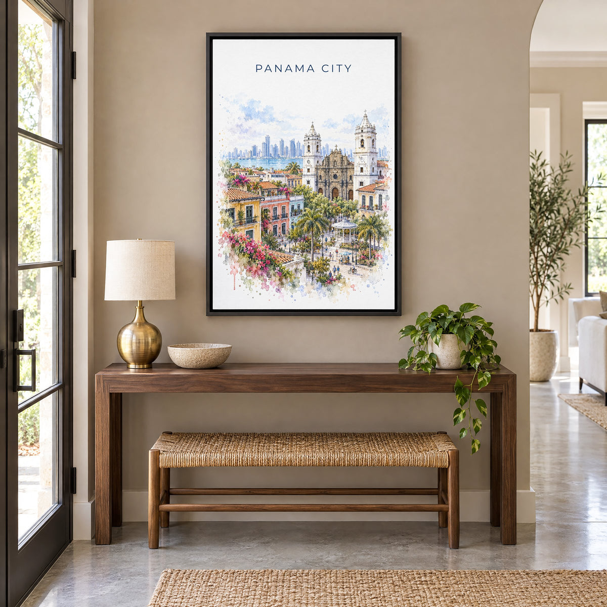 Panama City, Panama watercolor print as a black floater canvas above a walnut console and woven bench in an entryway