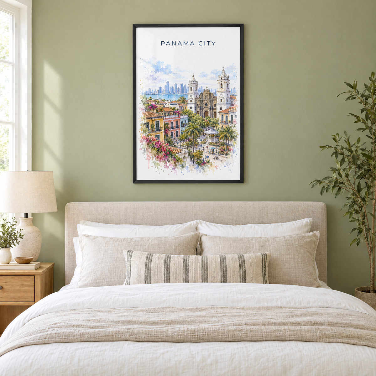 Panama City, Panama watercolor print in a black frame above an upholstered headboard in a sage green bedroom