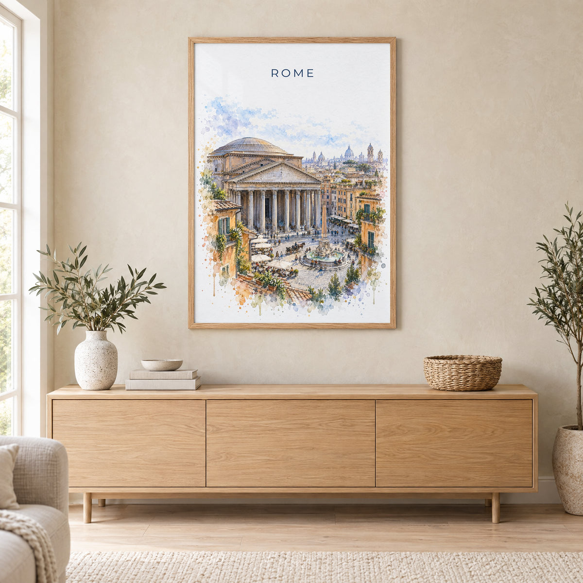Pantheon Rome watercolor print in an oak frame above a light wood sideboard in a Scandinavian living room