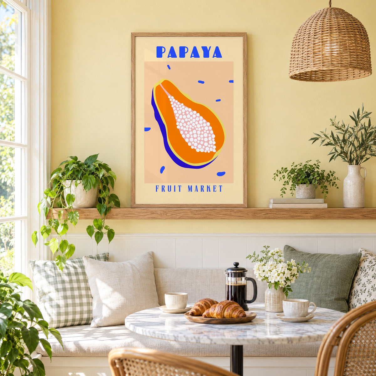 Papaya Fruit Market print in an oak frame on a picture ledge above a sunny breakfast nook