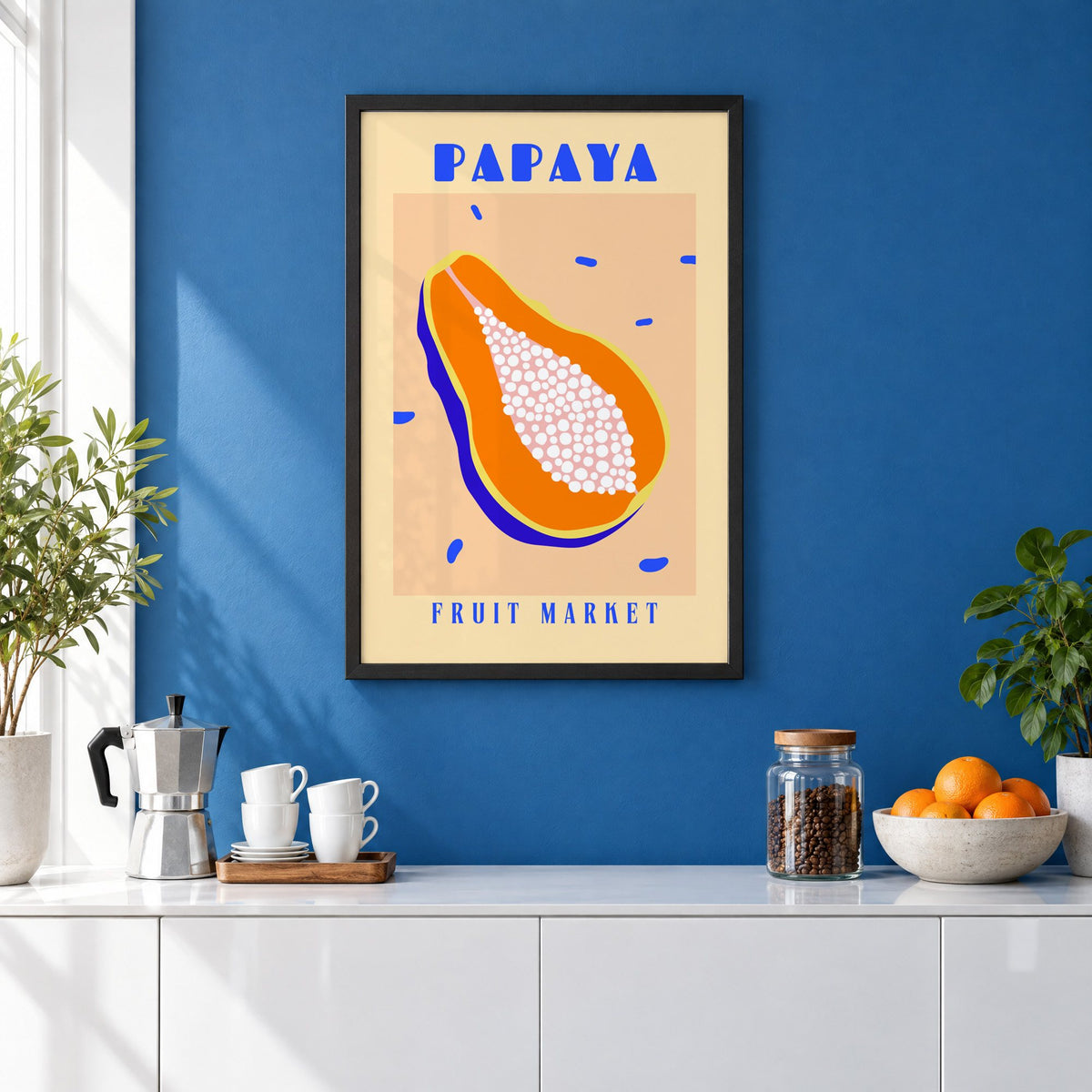Papaya Fruit Market print in a black frame on a cobalt blue wall above a coffee station
