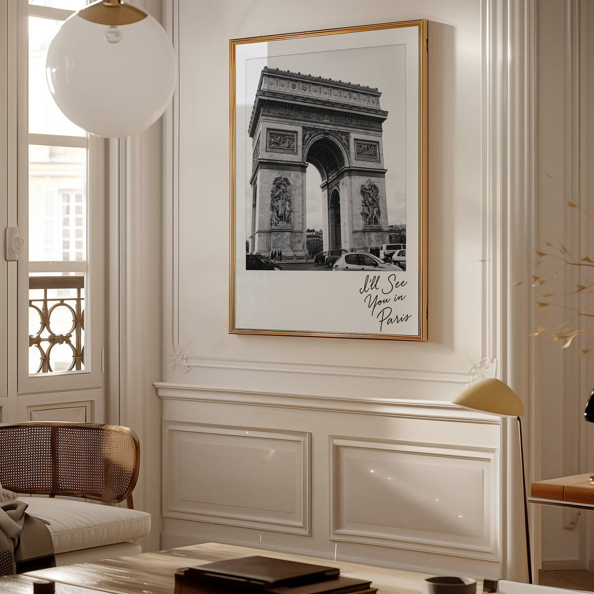 Arc de Triomphe instant photo with Paris script print shown in a gold frame in a Parisian paneled living room