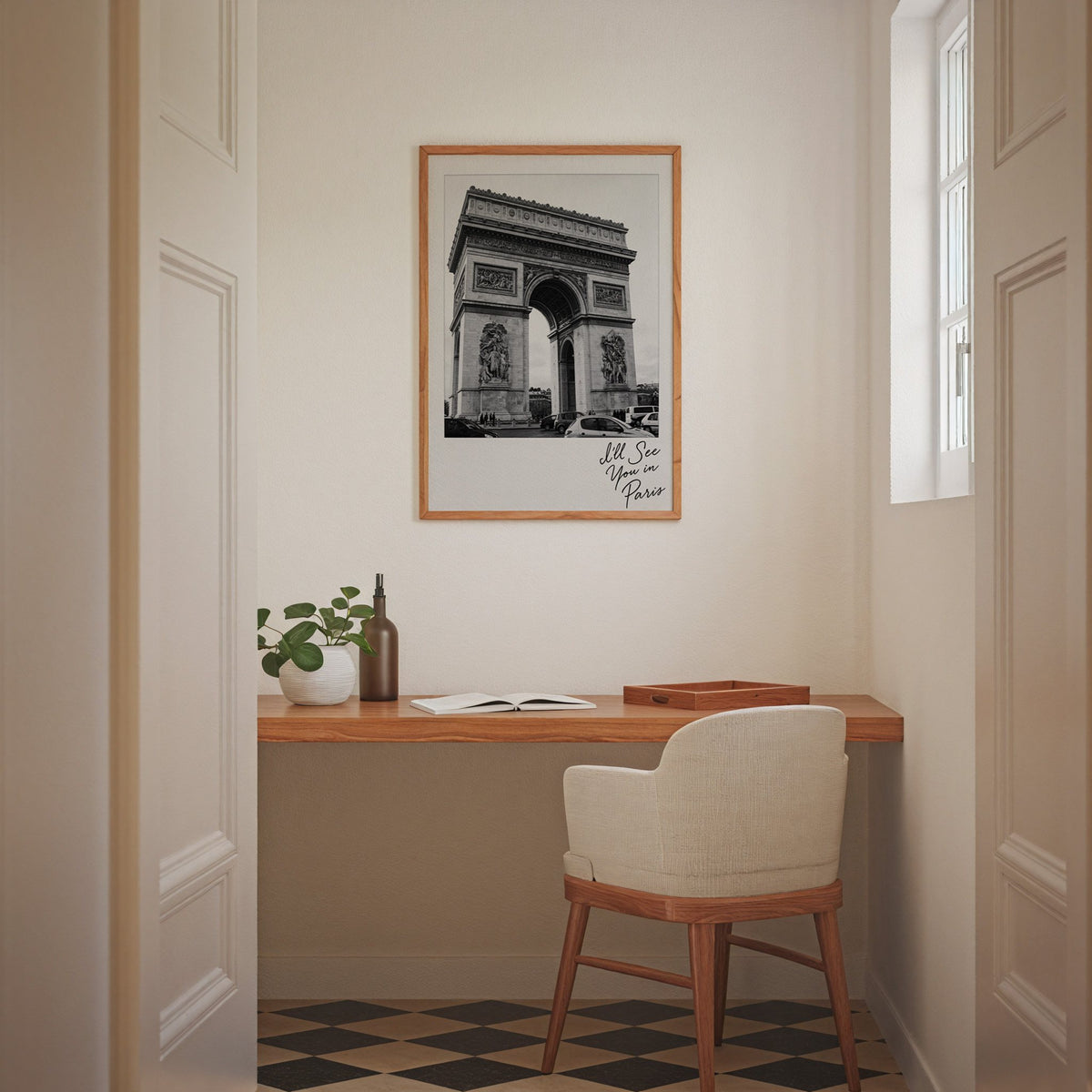 Arc de Triomphe instant photo with Paris script print in an oak frame above a home office desk nook