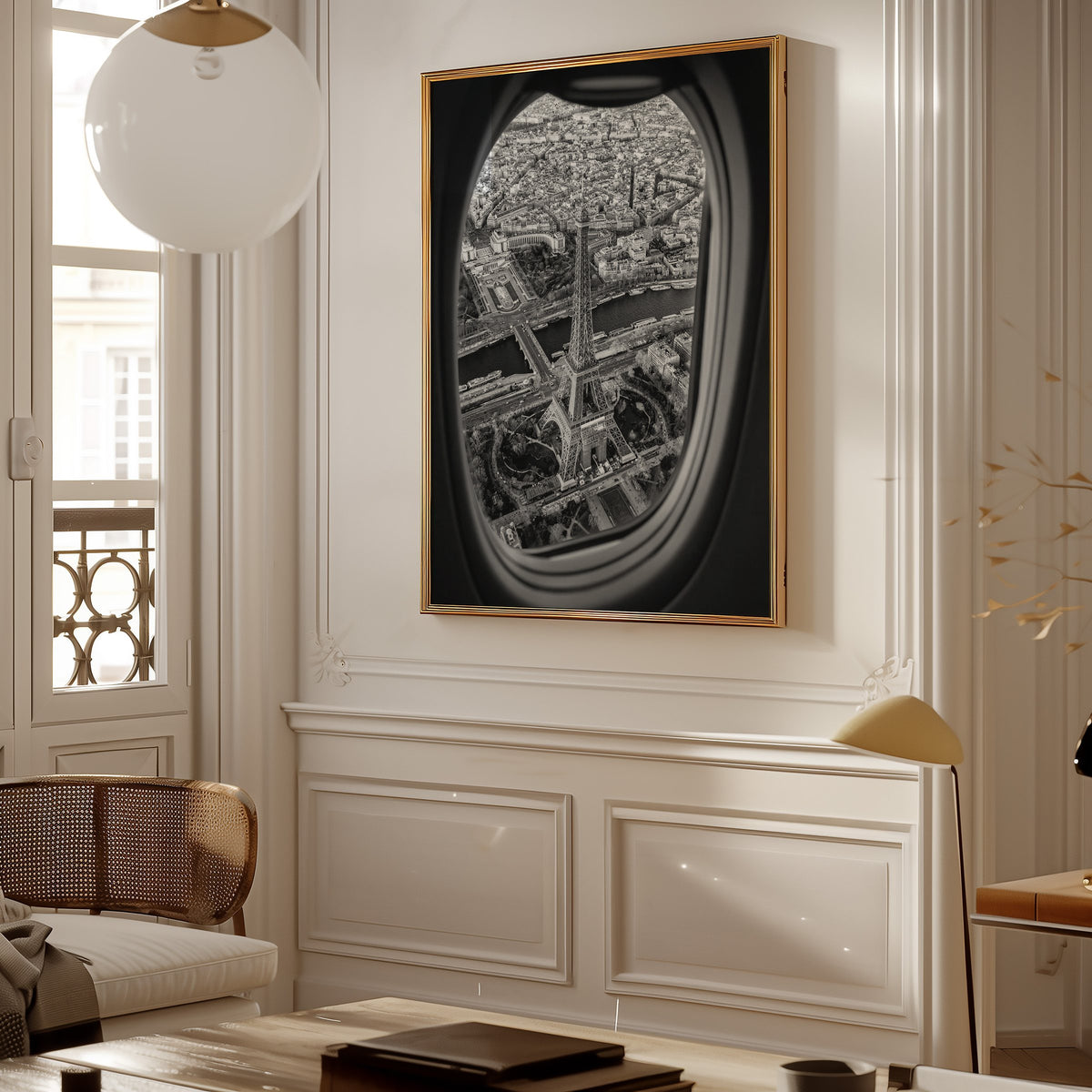 Eiffel Tower seen through an airplane window print shown in a gold frame in a Parisian paneled living room