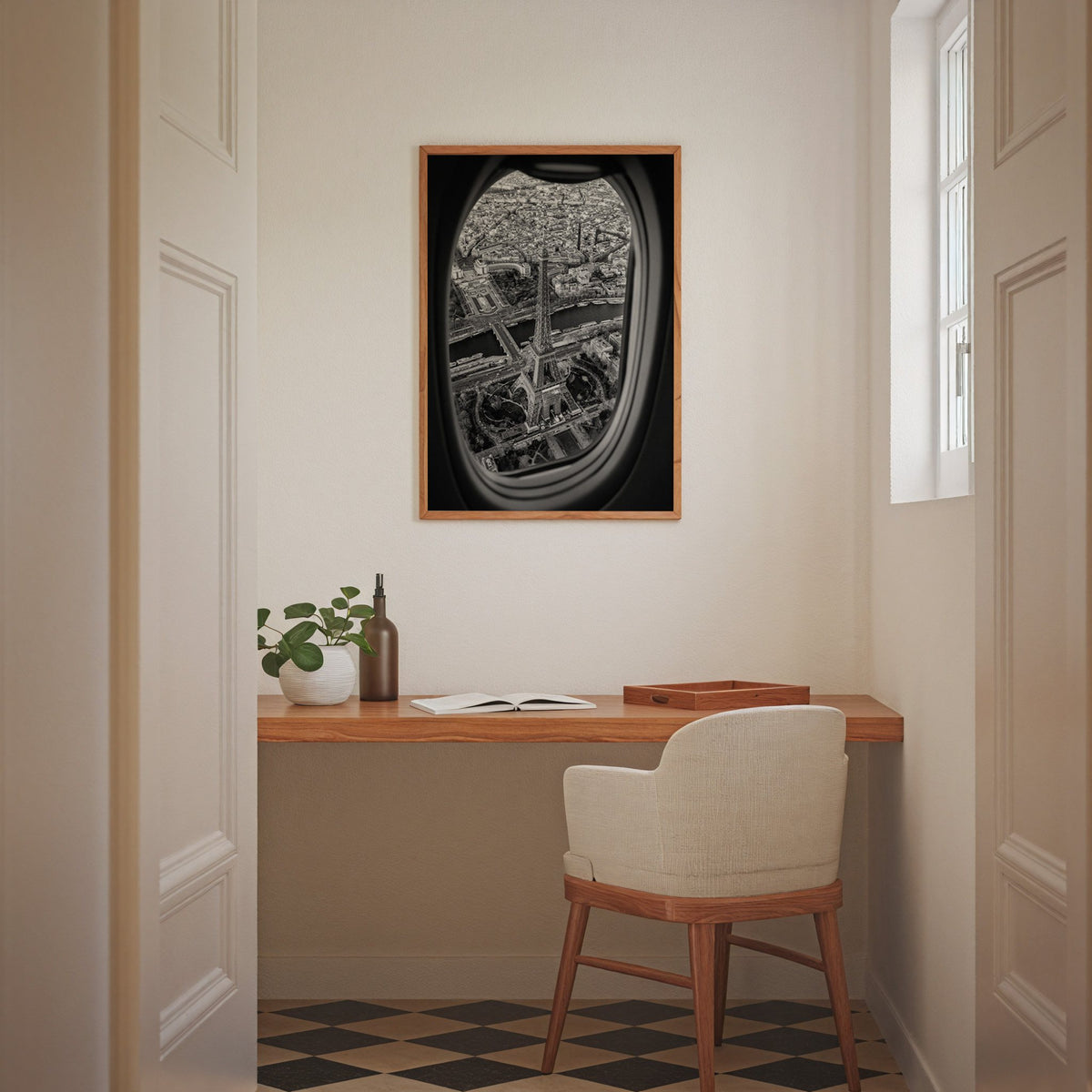 Eiffel Tower seen through an airplane window print in an oak frame above a home office desk nook