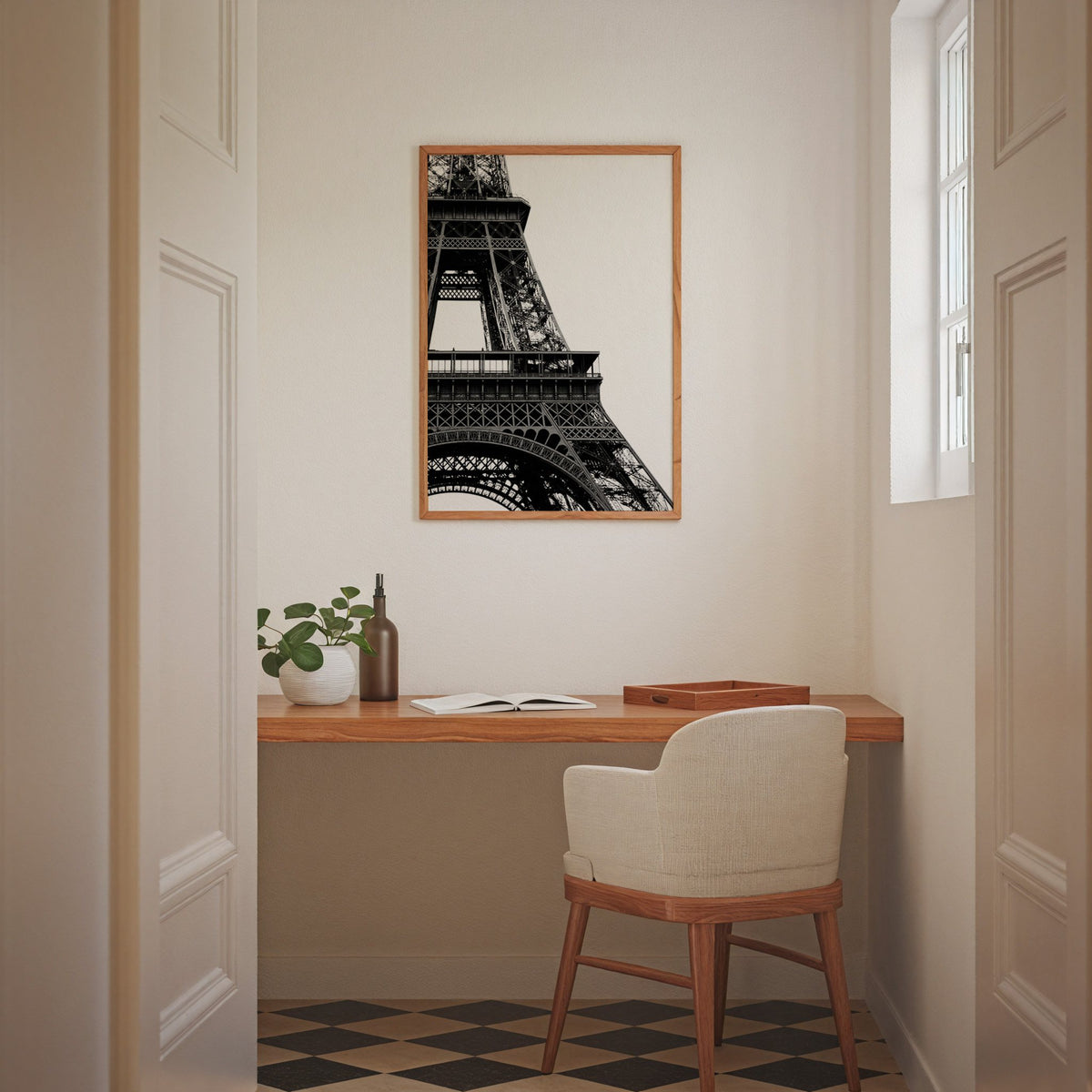 Eiffel Tower close-up on white background print in an oak frame above a home office desk nook