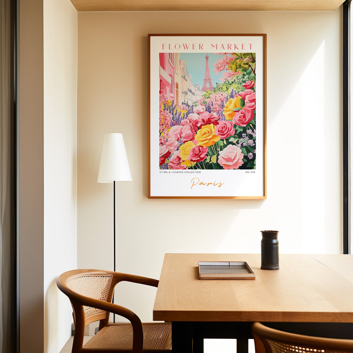 Paris flower market print in an oak frame above a dining table and cane chair