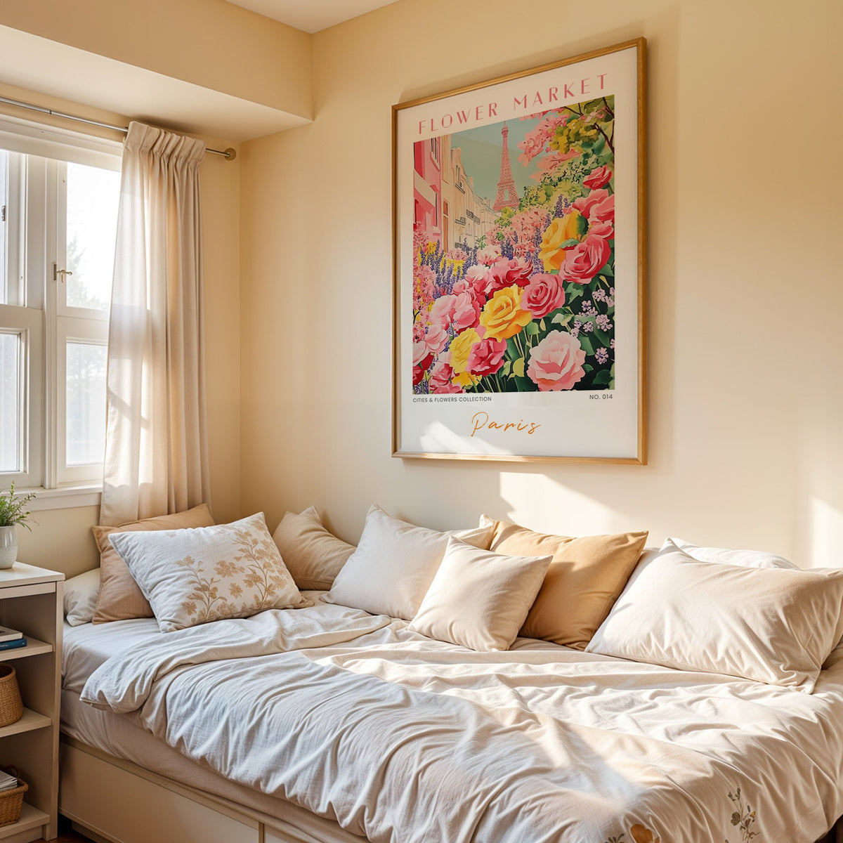 Paris flower market print in an oak frame above a cream daybed in a sunny bedroom