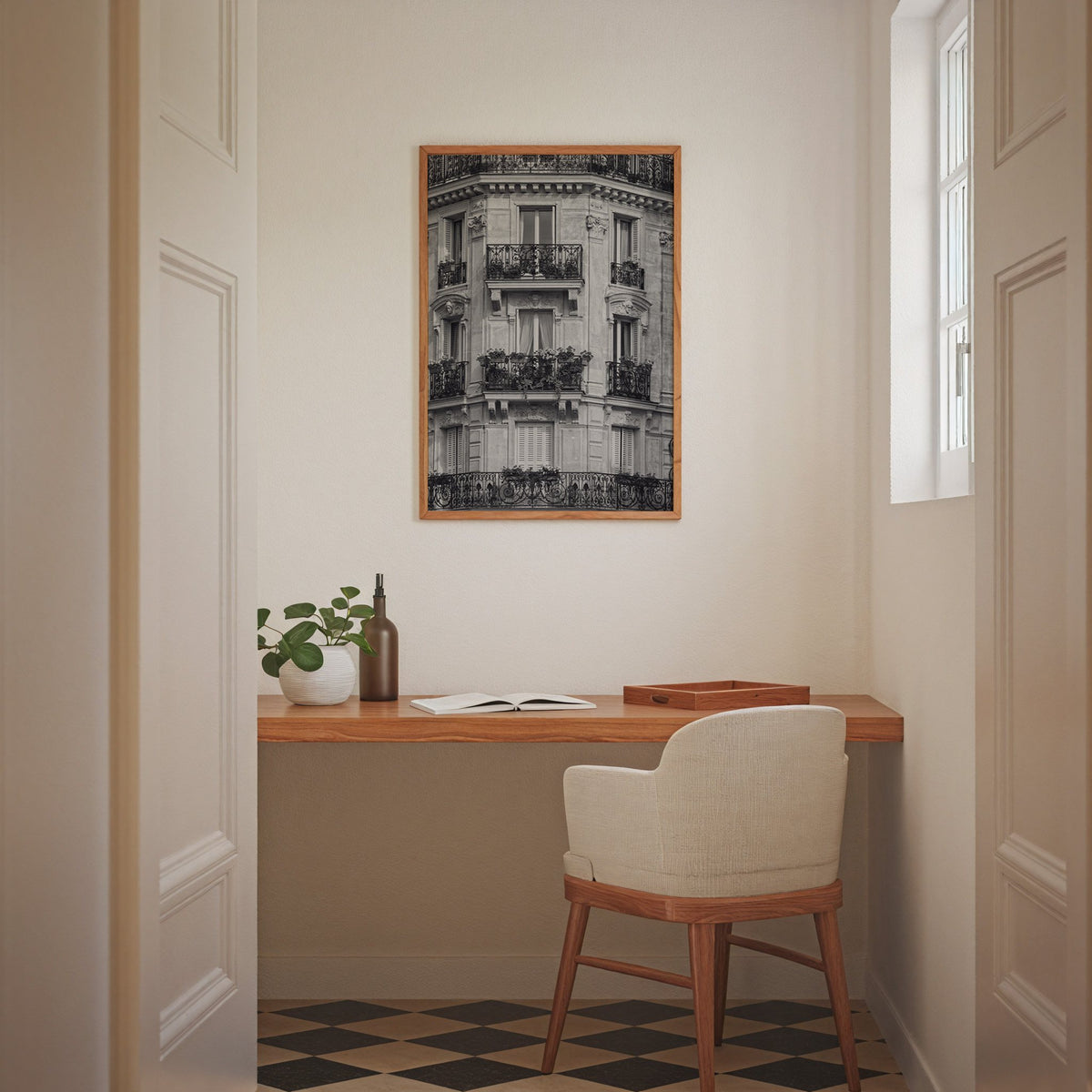 Paris facade with wrought iron balconies print in an oak frame above a home office desk nook