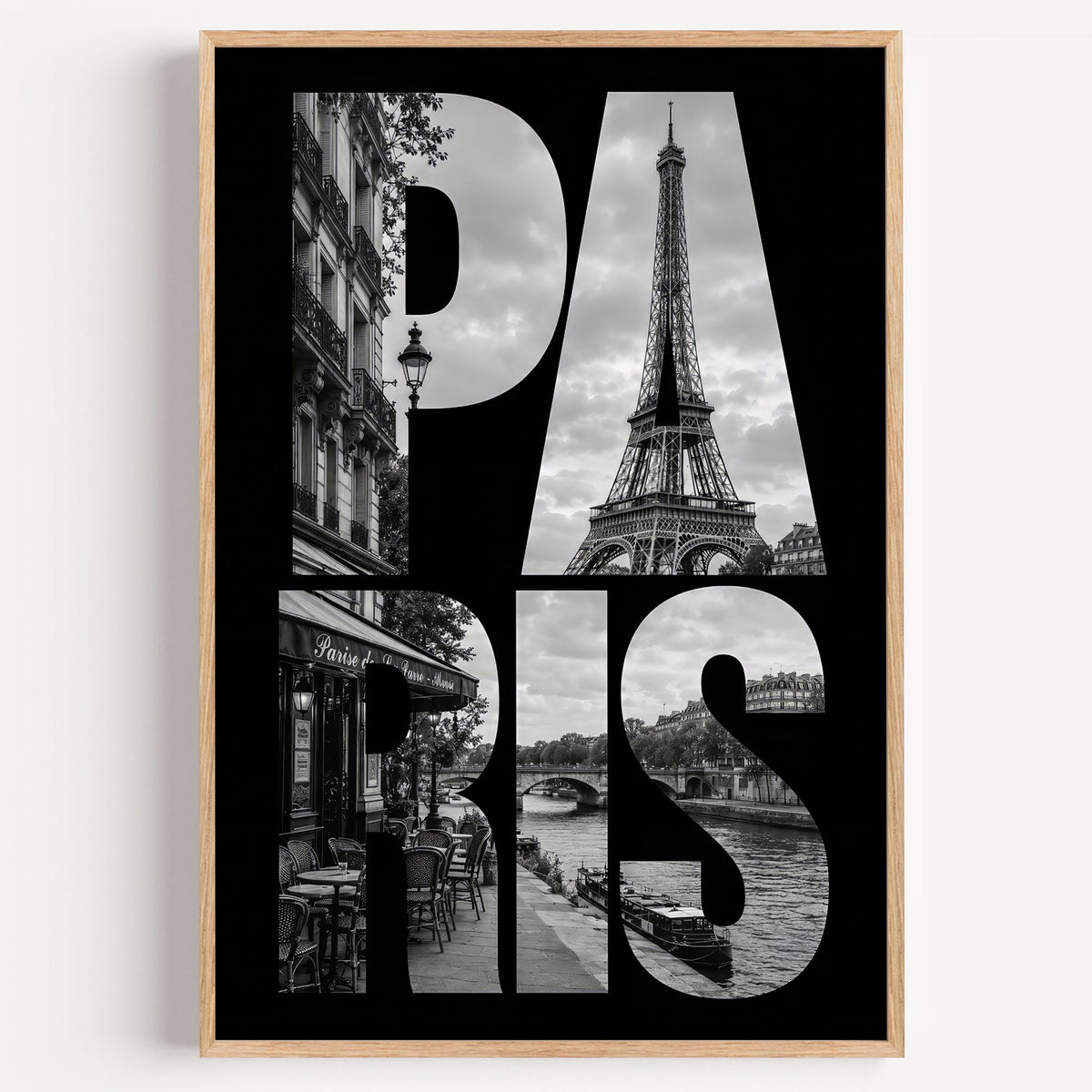 Paris letters filled with Eiffel Tower photo print in a light oak frame on a plain white wall