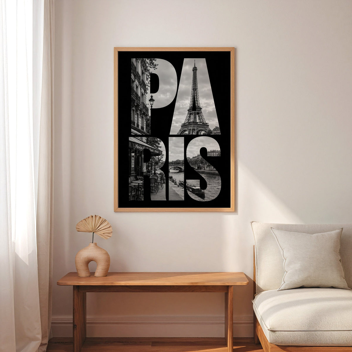 Paris letters filled with Eiffel Tower photo print in an oak frame above a narrow console with an arched vase