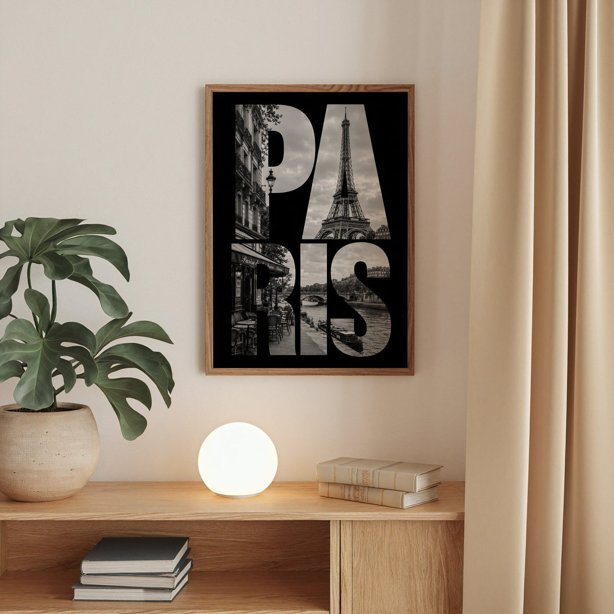 Paris letters filled with Eiffel Tower photo print in a walnut frame above an oak cabinet with a glowing globe lamp