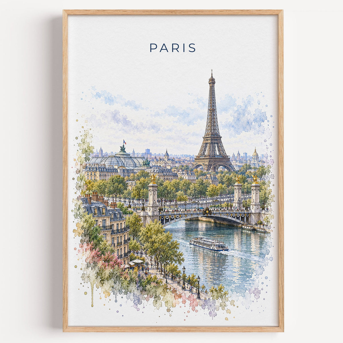Paris watercolor print in a light oak frame on a plain white wall
