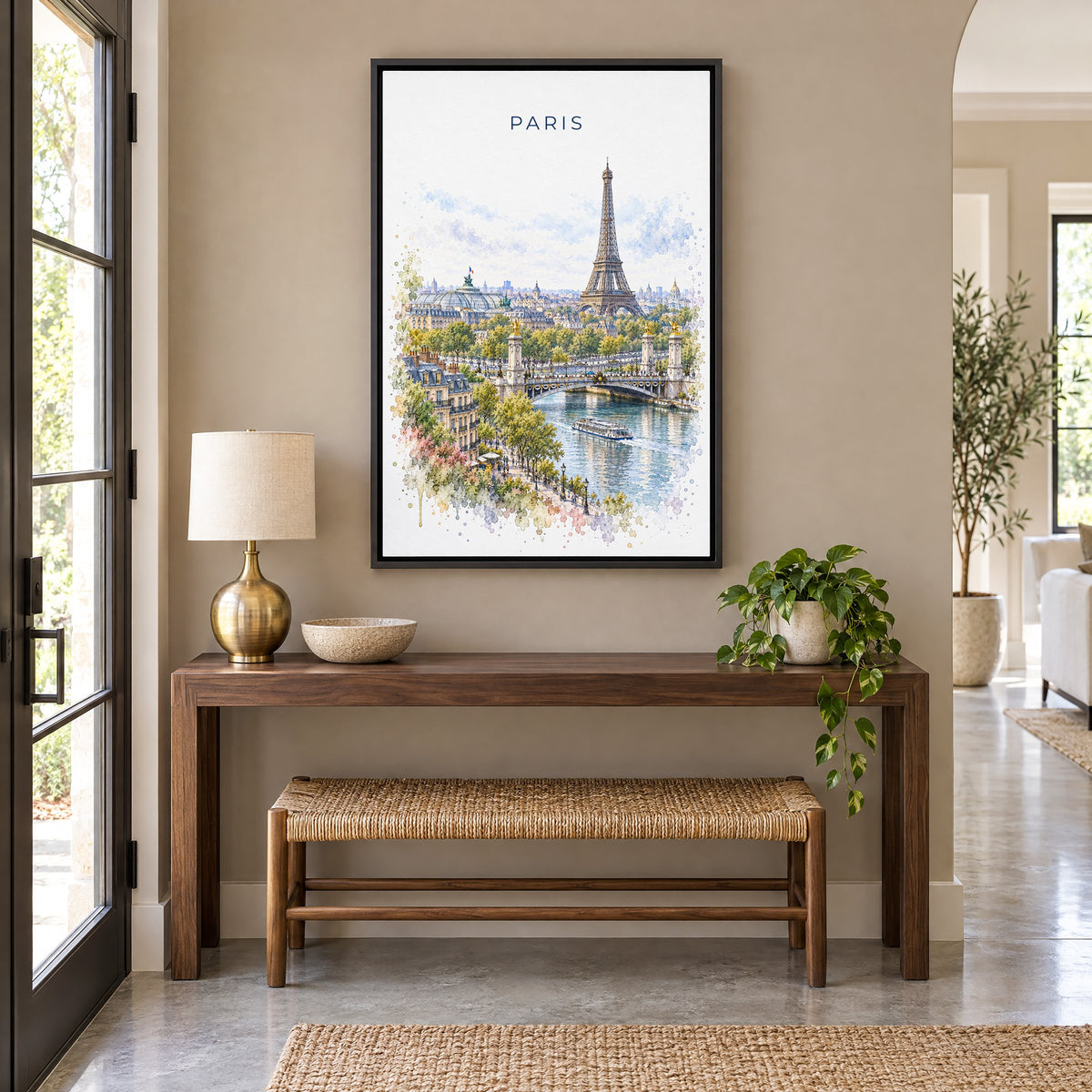 Paris watercolor print as a black floater canvas above a walnut console and woven bench in an entryway