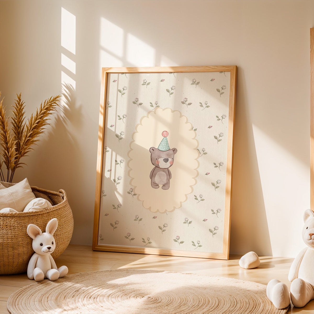 Bear in a mint party hat on rosebud wallpaper nursery print in an oak frame leaning on a sunlit floor by a woven basket