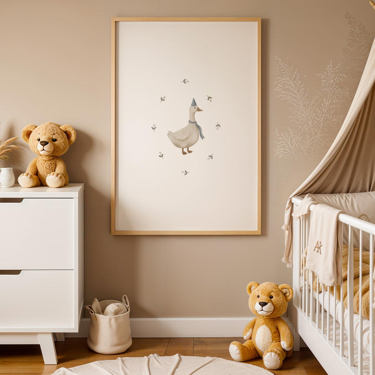 Goose in a blue party hat and scarf nursery print in an oak frame between a white dresser and a canopy crib