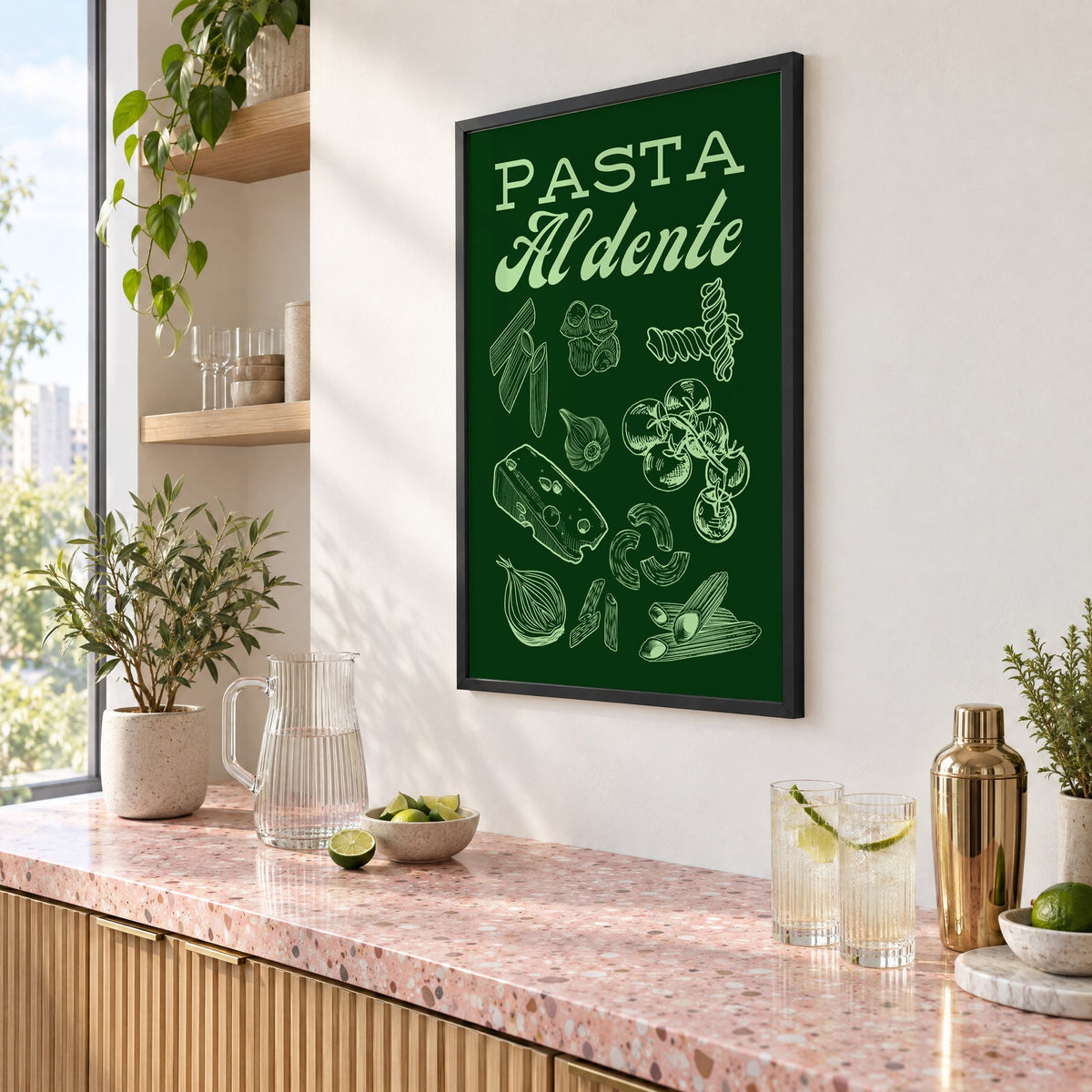 Pasta Al dente engraved green print in a black frame above a pink terrazzo cocktail counter with limes, seen at an angle