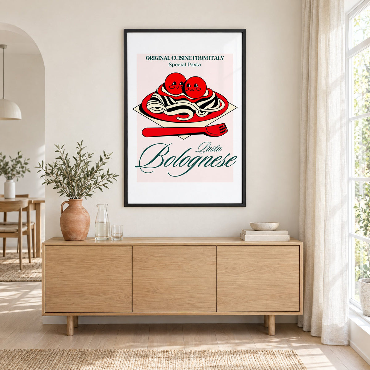 Pasta Bolognese smiling meatballs print in a black frame above an oak sideboard with a terracotta vase of olive branches
