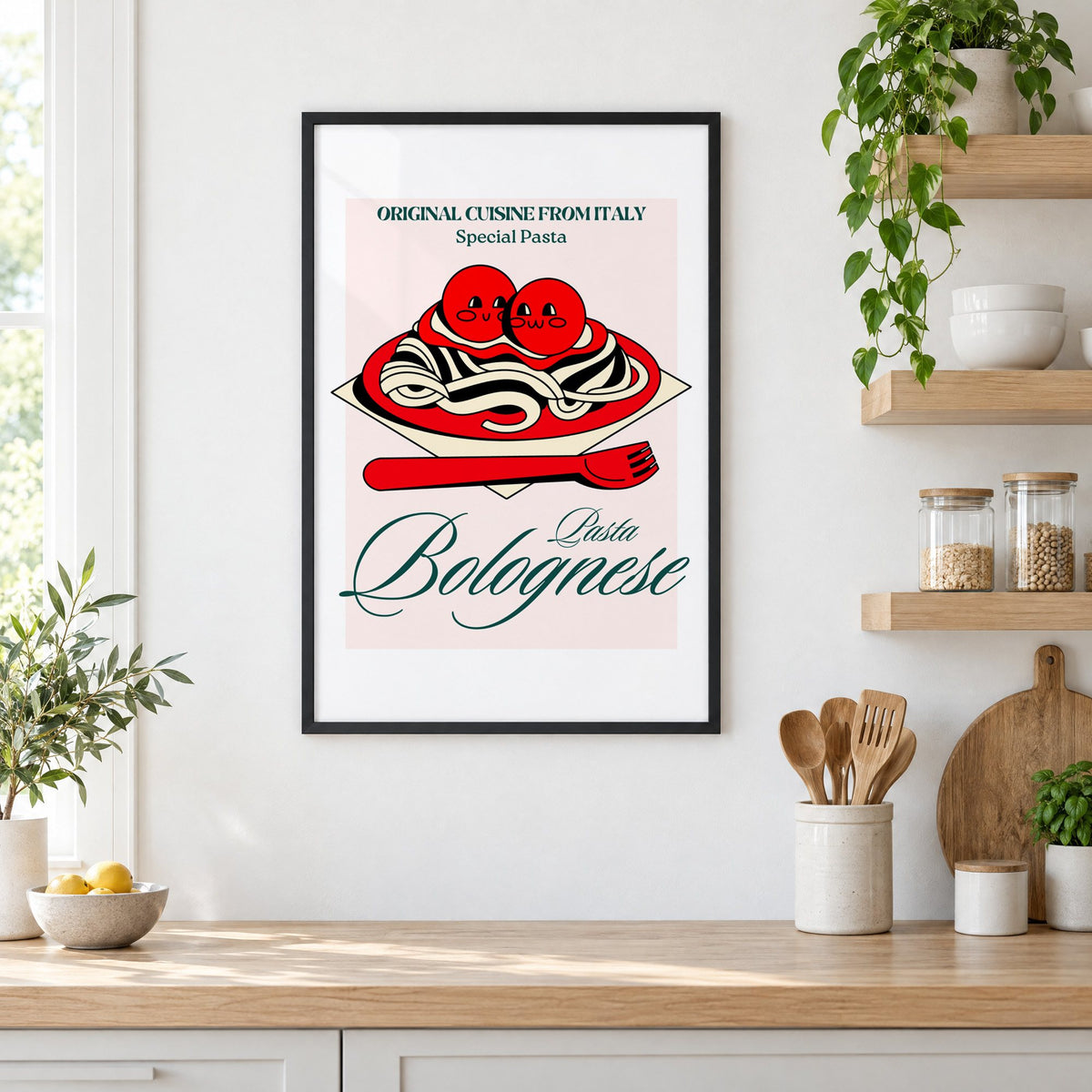 Pasta Bolognese smiling meatballs print in a black frame in a white kitchen beside open wood shelves and glass jars