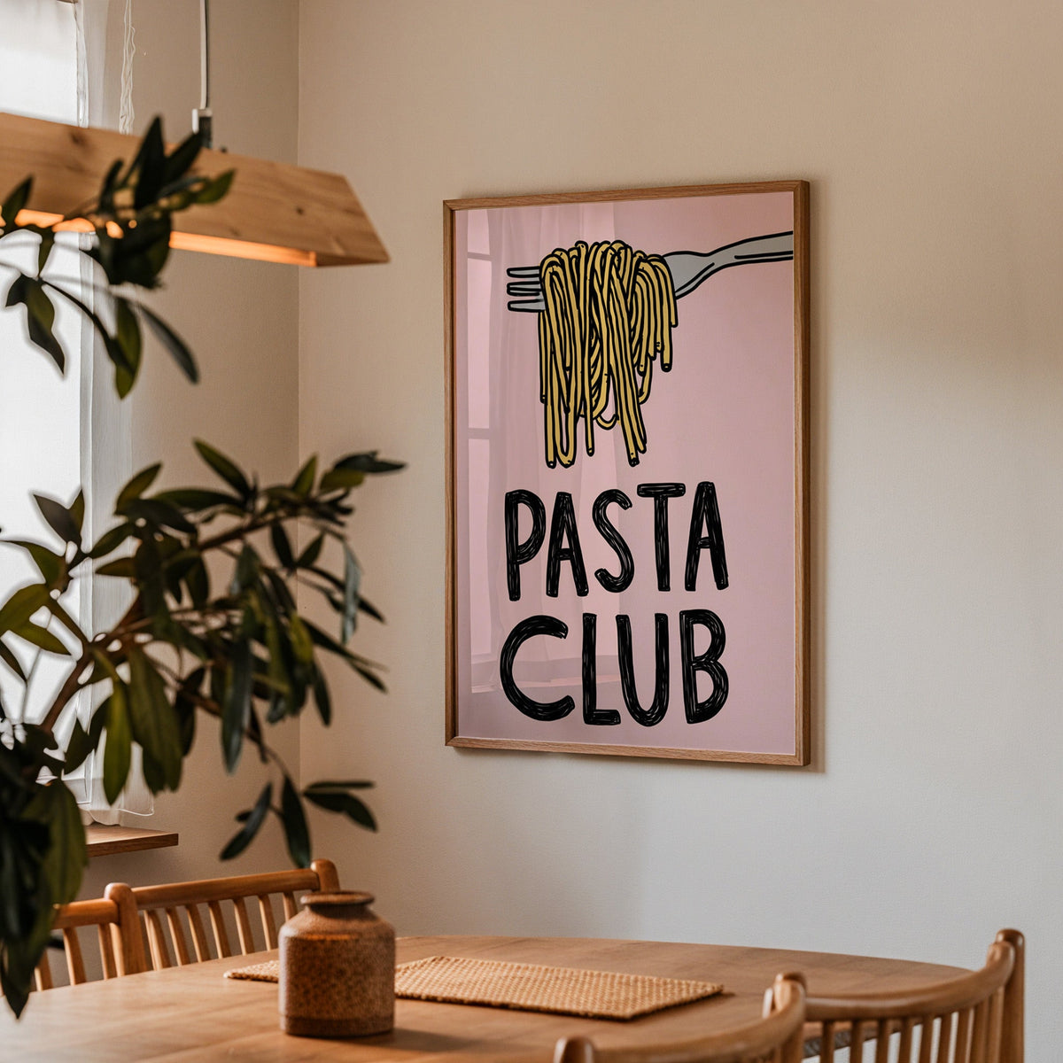 Pasta Club print in a walnut frame above a dining table with olive branches