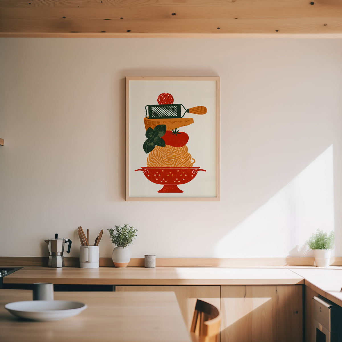 Pasta colander print in an oak frame above a wood counter with a moka pot