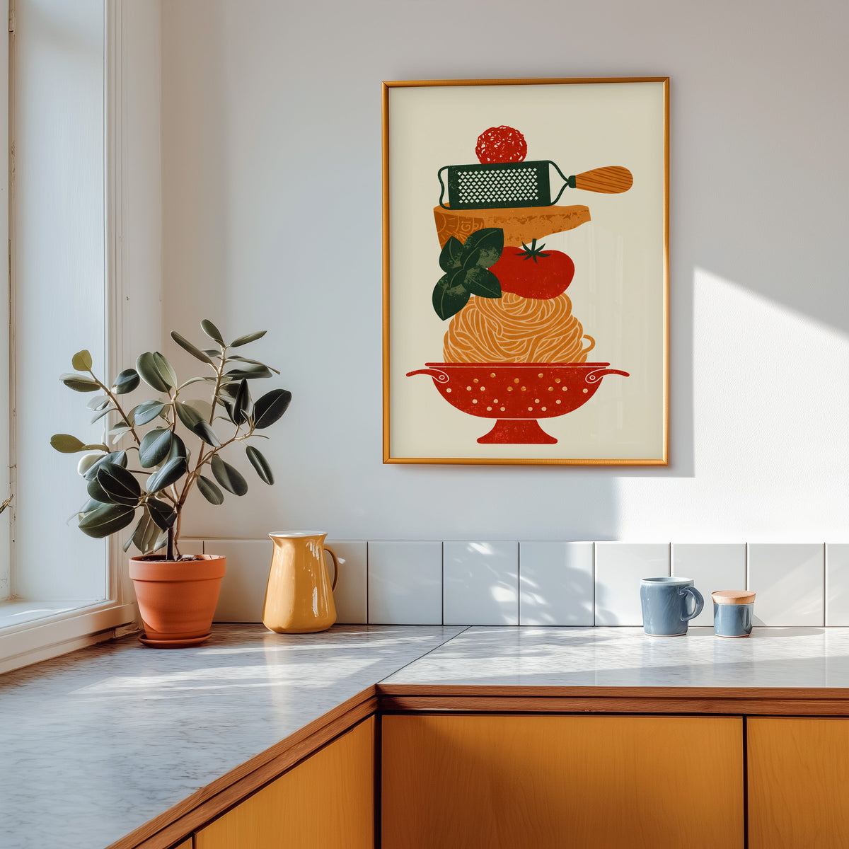 Pasta colander print in a gold frame above a marble counter with a yellow jug