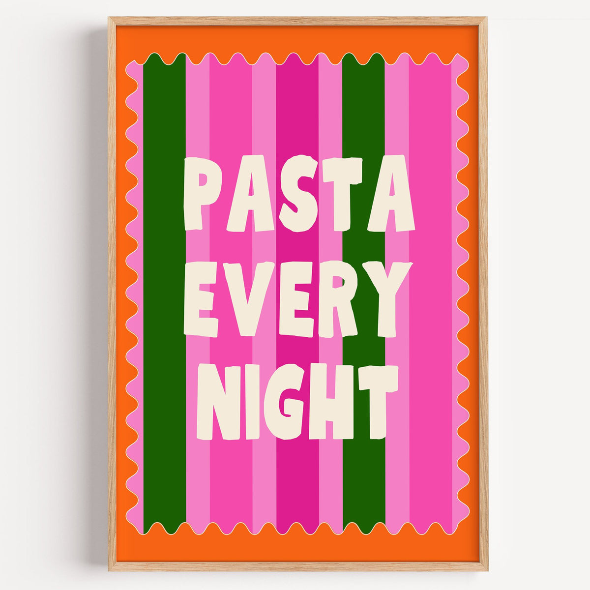 Pasta Every Night pink stripe print in a light oak frame on a plain white wall