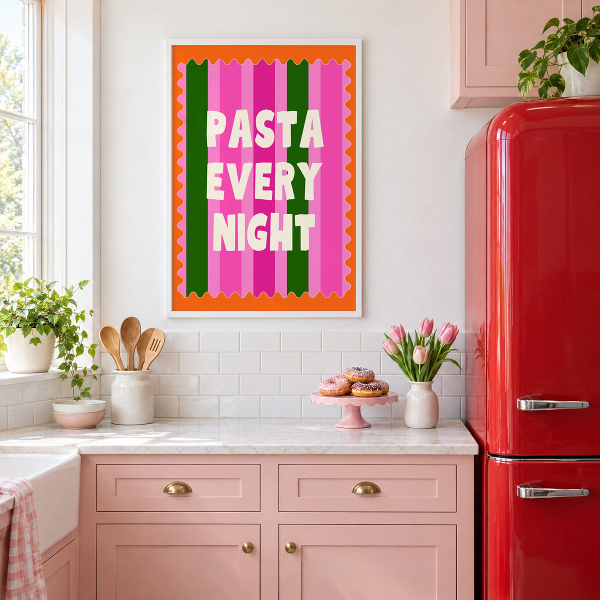 Pasta Every Night pink stripe print in a white frame in a pink kitchen beside a red retro fridge