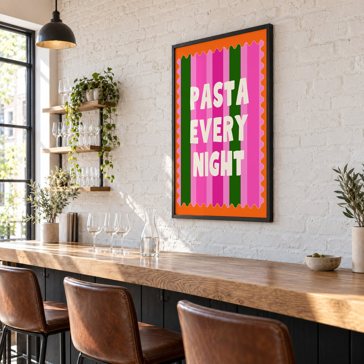 Pasta Every Night pink stripe print in a black frame on a white brick wall above a wine bar counter