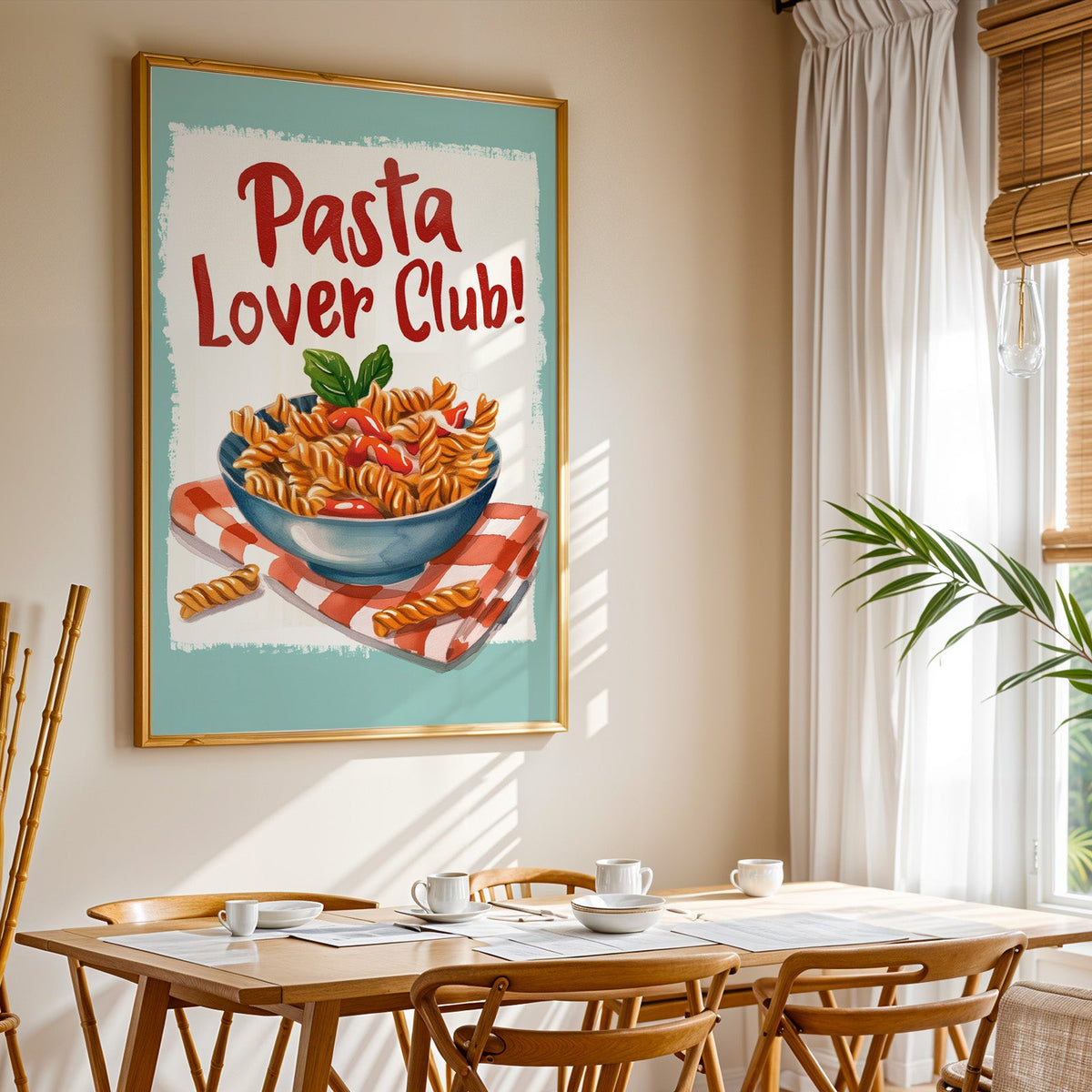 Pasta Lover Club fusilli print shown in a gold frame above a breakfast table by a curtained window