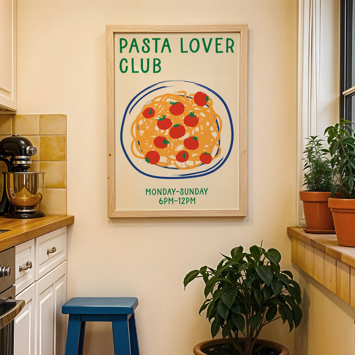 Pasta lover club print in a wood frame on a yellow tiled kitchen wall