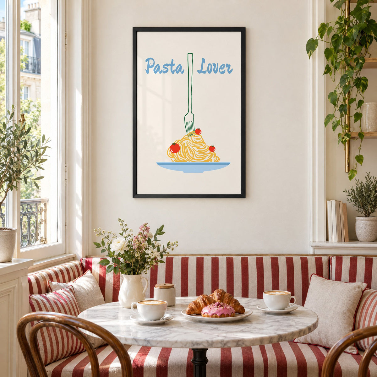 Pasta Lover fork and spaghetti print in a black frame above a striped cafe breakfast nook with cappuccino and pastries
