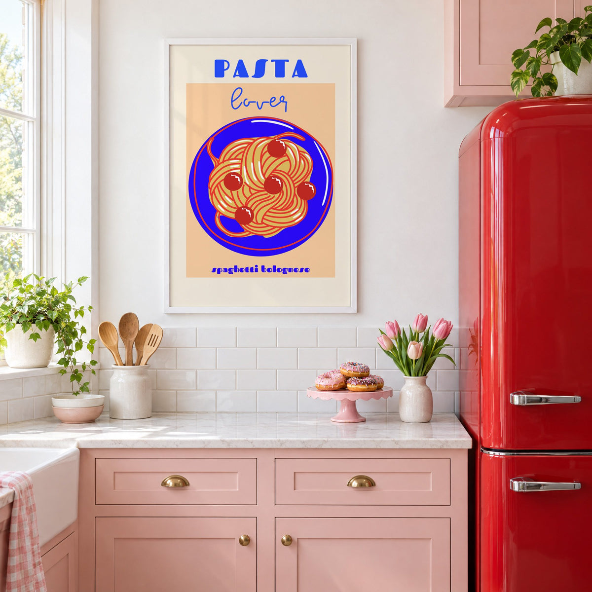 Pasta lover blue plate spaghetti print in a white frame in a pink kitchen beside a red retro fridge