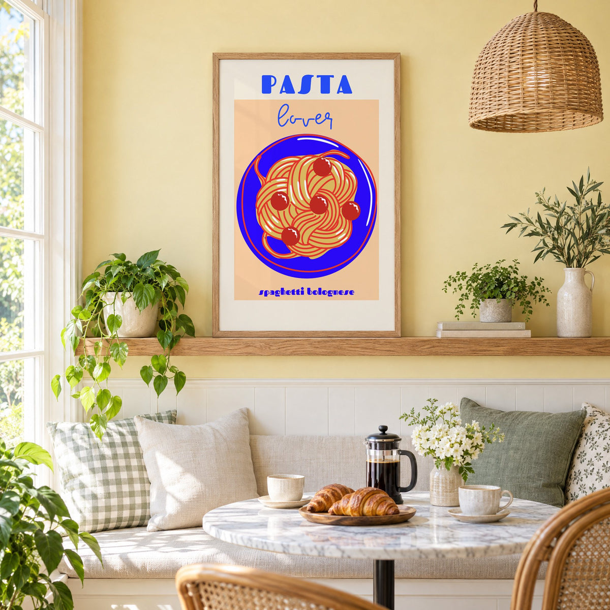 Pasta lover blue plate spaghetti print in an oak frame on a picture ledge above a sunny breakfast nook