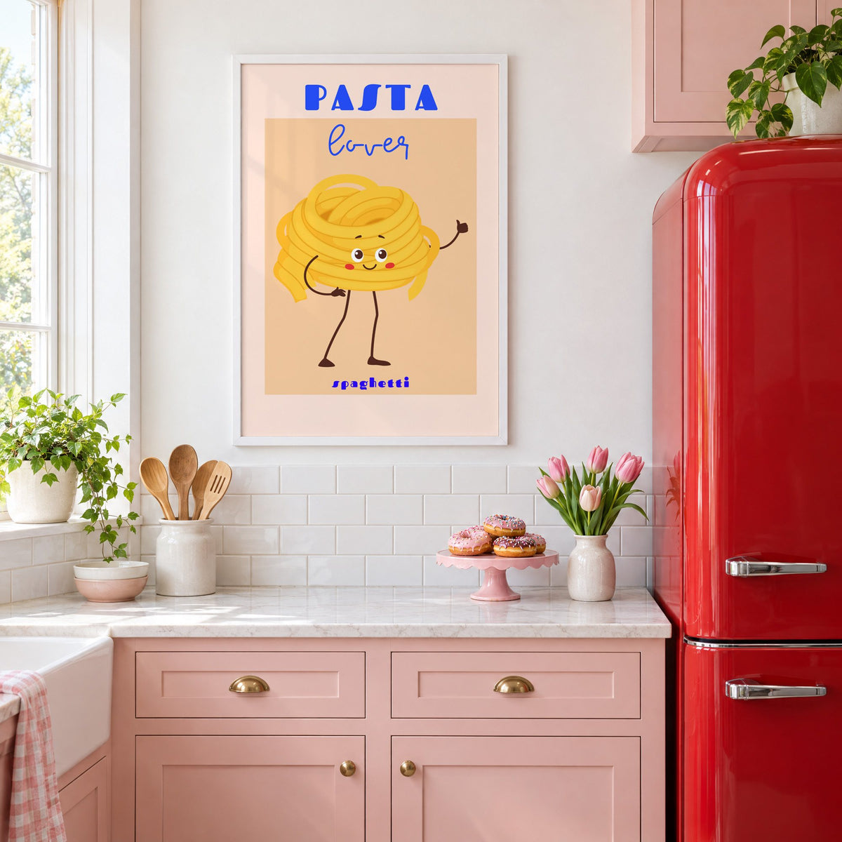 Pasta lover spaghetti character print in a white frame in a pink kitchen beside a red retro fridge