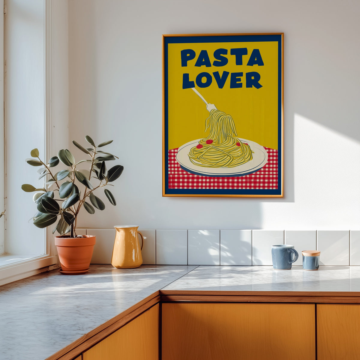 Pasta Lover yellow print shown in a gold frame above a marble counter in a tan kitchen