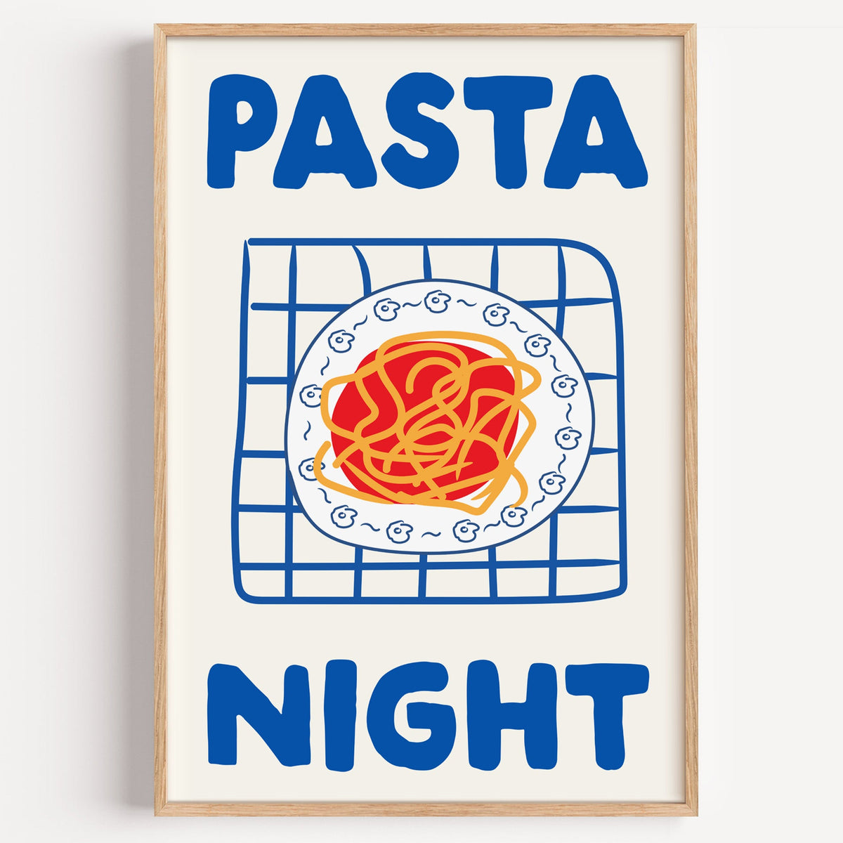 Pasta night blue print in a light oak frame on a plain white wall