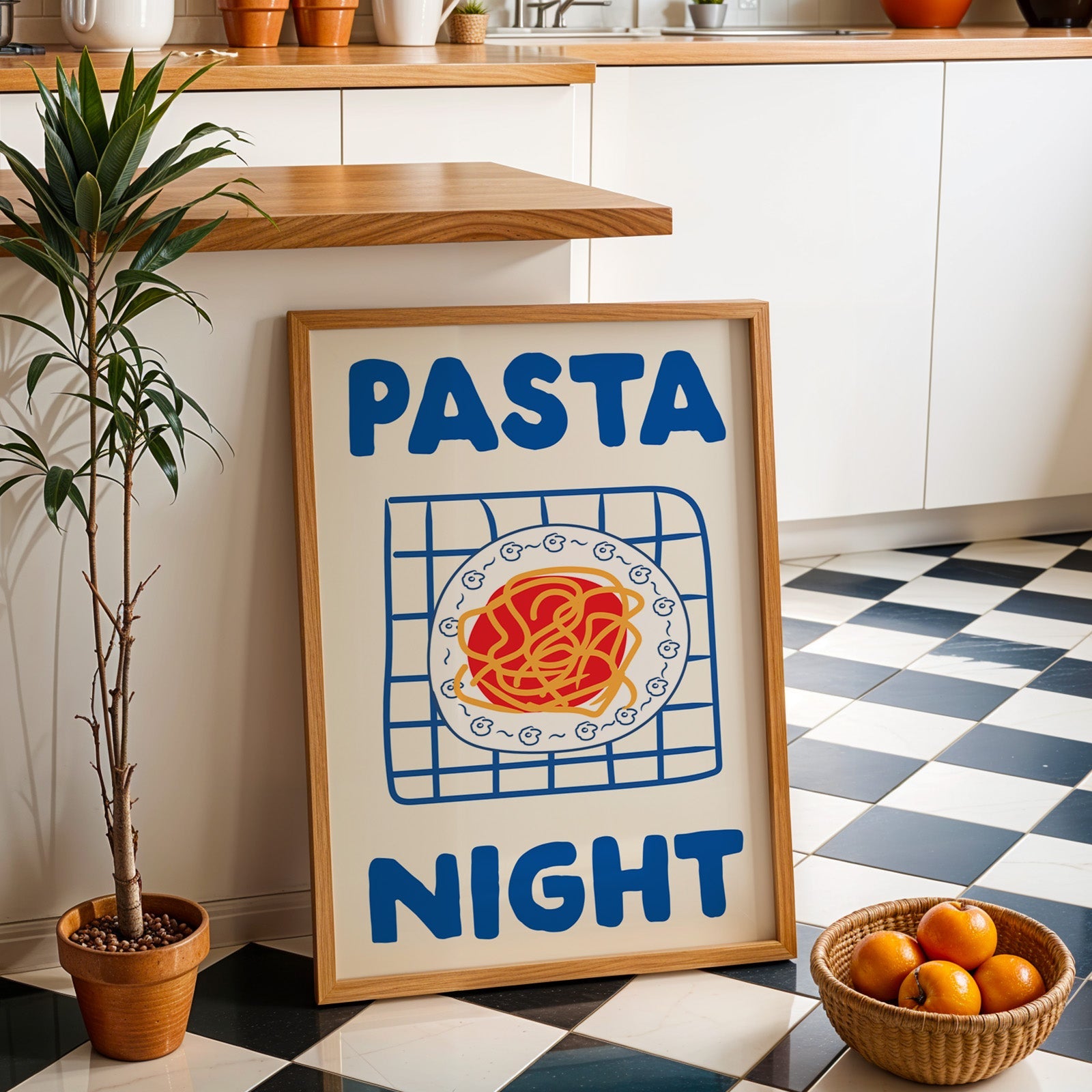Pasta night blue print in an oak frame by a kitchen island and checkered floor