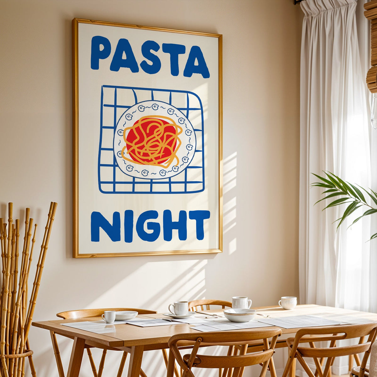 Pasta night blue print in a gold frame above a sunlit breakfast table